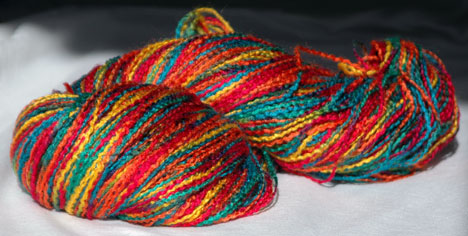 500-yard hank of rainbow-colored 100% rayon yarn.